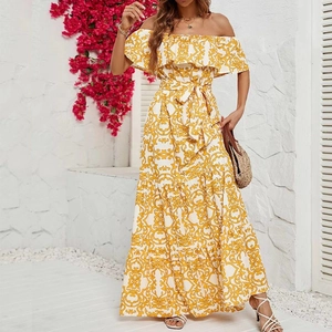 Close-up of off-shoulder neckline with ruffle trim and yellow vintage floral print
