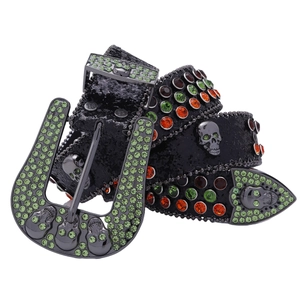 Black leather belt with green rhinestones and silver skull buckles in Y2K style