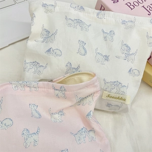 Close-up of cute cat pattern on pink and beige canvas cosmetic bags with metal zipper