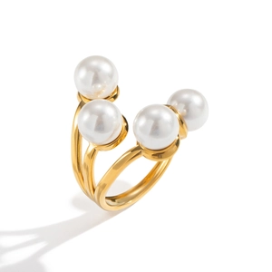 Detailed view of 18K gold plated geometric ring featuring four lustrous white pearls