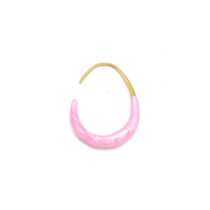 Close-up of gold U-shaped earrings with pink pearlescent resin drop detail