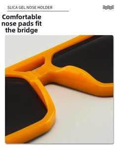 Detailed macro shot of comfortable orange silica gel nose pads on full frame sunglasses