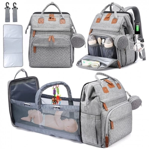 Detail view of large capacity diaper bag expanding into a portable baby travel bassinet