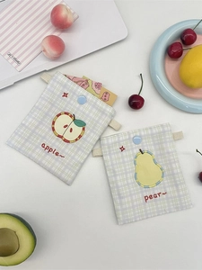 Cute embroidered fruit pouches with apple and pear patterns on green checkered fabric