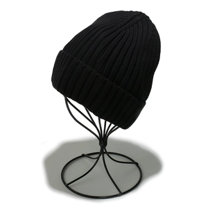 Detailed view of black ribbed knit beanie featuring premium thick cotton texture