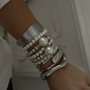 Multi-layer silver bangle set with white pearls and textured metal cuffs for women