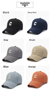 Detail view of cotton baseball caps in six colors with towel embroidered C letter