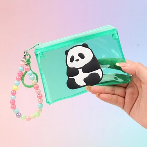 Close-up of a green transparent PVC panda coin purse with a colorful bead charm handle