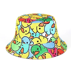 Detail of colorful cartoon duck print on twill cotton fabric of a sun bucket hat