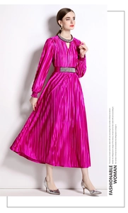 Detail of beaded neckline and pleated waist on fuchsia silk-like cocktail dress