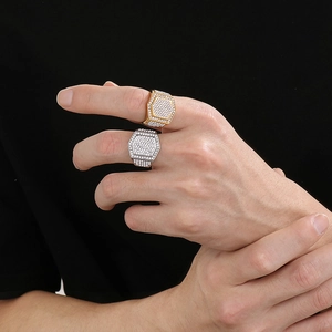 Macro detail of men's hip hop ring with luxury iced out pavé hexagon setting