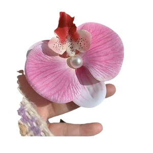 Pink gradient orchid hair clip with center pearl detail shown on a white background