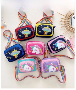 Detailed view of kids cartoon crossbody bags with rainbow straps in unicorn and space themes