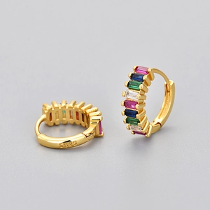 Detail of S925 sterling silver stamp on gold hoop earrings with rectangle colored zircons