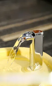 Close-up of stainless steel faucet outlet showing waterfall flow for cat water fountain
