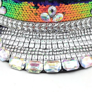 Detailed view of colorful sequins and multi-shaped rhinestones on a festive party hat