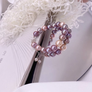 Detail of multi-color baroque pearl bracelet with adjustable silver chain and clasp