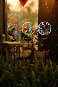 Solar silhouette garden stakes with dog, gnome, and cat designs and colorful LED lights