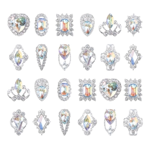 Mixed set of 24 silver alloy nail art charms with iridescent crystals in grid layout