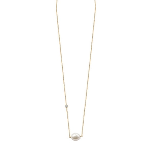 Close-up of golden S925 sterling silver chain with a white pearl and sparkling gemstone
