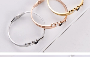 Detailed comparison of three stainless steel bracelets with rhinestones and black inlay