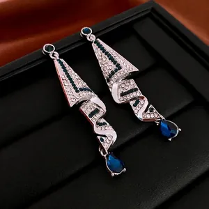 Luxury geometric drop earrings with silver plating, blue stones and crystal fringe