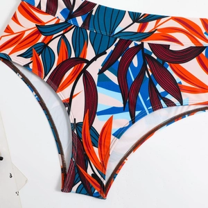 Detail showing tropical floral print high waisted bikini bottoms with wide elastic waistband