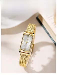 Detail of GEDI rectangular gold watch featuring embossed texture dial and mesh steel strap