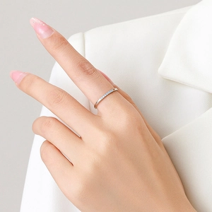 Elegant S925 sterling silver ring with micro-pave zircons worn on a model's finger