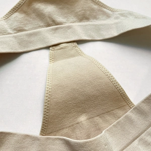 Elastic seamless thong underwear in nude knit fabric with high-stretch shoulder strap detail