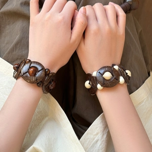 Bohemian wood bead and coconut shell woven bracelets with geometric ethnic design