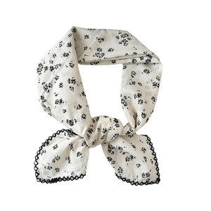 White cotton linen floral scarf with delicate black flower patterns and lace trim border
