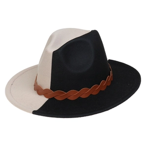 Detail of two-tone wool fedora featuring a brown braided leather band and wide brim