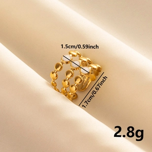 Detail shot of golden triple-layer ring with white enamel inlay and dimension specs