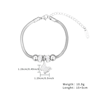 Detail of silver snake chain bracelet with butterfly charm and S.STEEL material mark