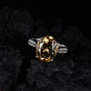 Macro shot of an elegant S925 sterling silver ring with a large faceted yellow citrine stone