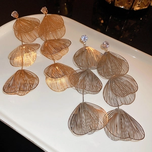 Exaggerated metal fishtail tassel earrings with hollow layered design and zircons