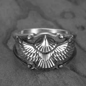 Vintage stainless steel eagle wing ring with detailed feather texture in retro style