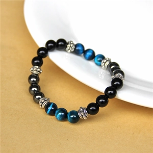 Bracciale occhio di tigre naturale con perle nere e distanziali in metallo argento