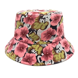 Detail of floral print bucket hat featuring pink flowers and sparkling rhinestone accents