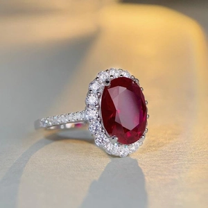S925 sterling silver ring featuring a large oval red gemstone with zircon halo