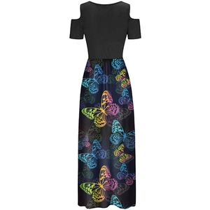 Detail of the cold shoulder design and colorful butterfly print on the long maxi dress
