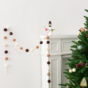 Handmade wool felt Christmas ball garland featuring snowman ornaments in earth tones