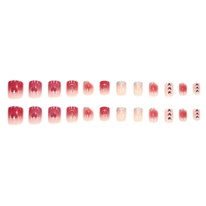 Gradient red and nude press-on nails with heart, butterfly and glitter decorations