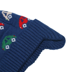 Close-up of thick navy knit hat with colorful cartoon car patterns and ribbed edge details