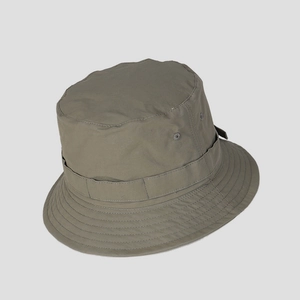 Close-up of olive green tactical bucket hat featuring reinforced stitching and utility loops
