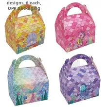 Macro detail of paper candy boxes featuring hollow handles and ocean theme scale patterns