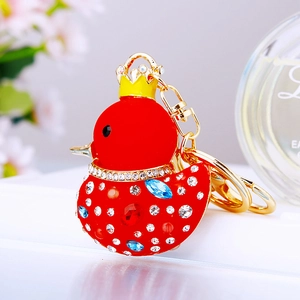 Close-up of red rhinestone duck keychain with gold crown and crystal gems