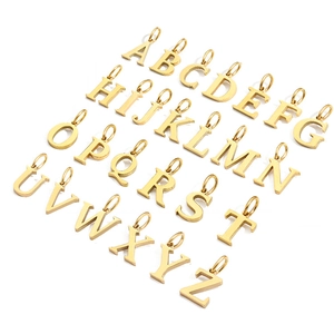 Top view of shiny gold-tone A-Z alphabet pendants for DIY jewelry making and necklaces