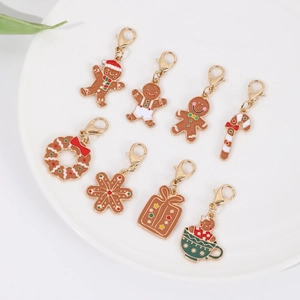 Detail of 8 Christmas-themed enamel charms with gold lobster clasps for DIY jewelry